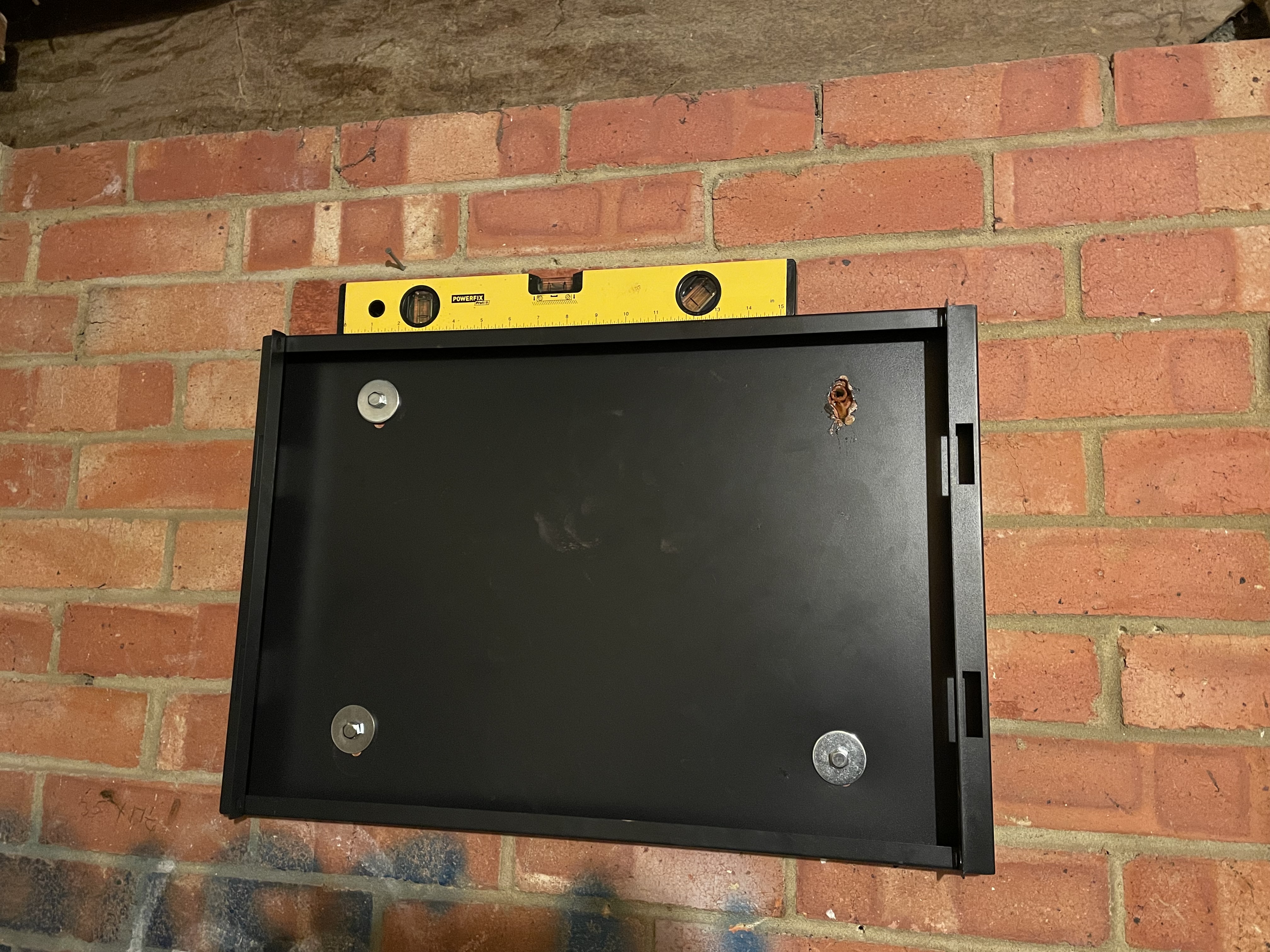 Photo of rear panel of rack case mounted to the wall